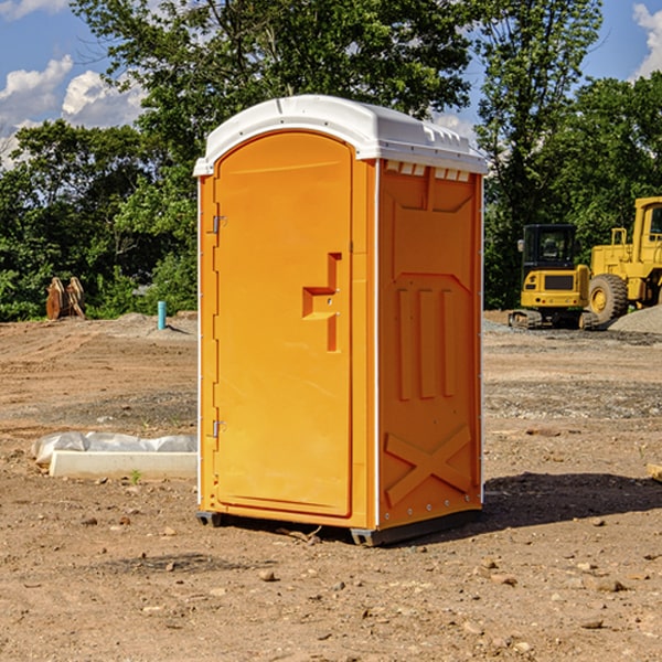 what is the cost difference between standard and deluxe portable restroom rentals in Adams